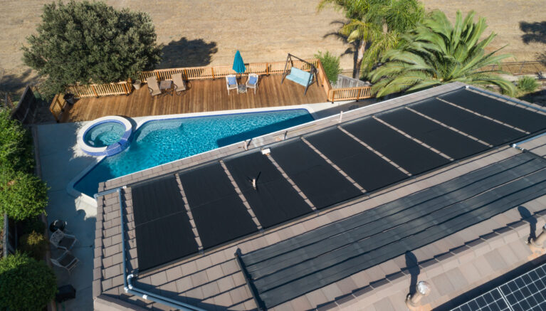 Thermal Solar Panels Installed on the Roof of a Large House.